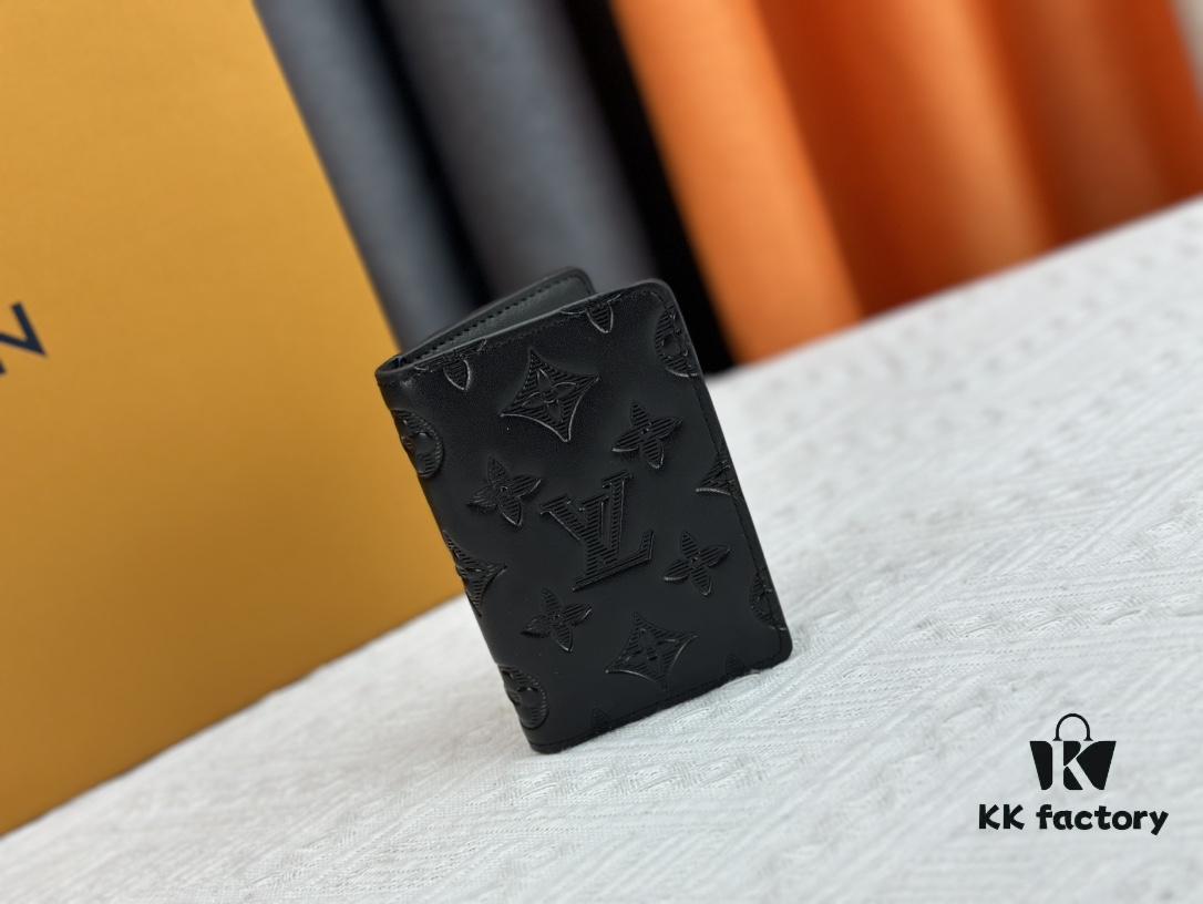 M62899 Wallet: This compact wallet reinterprets the classic design with Monogram Shadow leather. Soft cowhide is embossed with Louis Vuitton's iconic Monogram pattern, while interior compartments and card slots provide organized storage for everyday essentials.