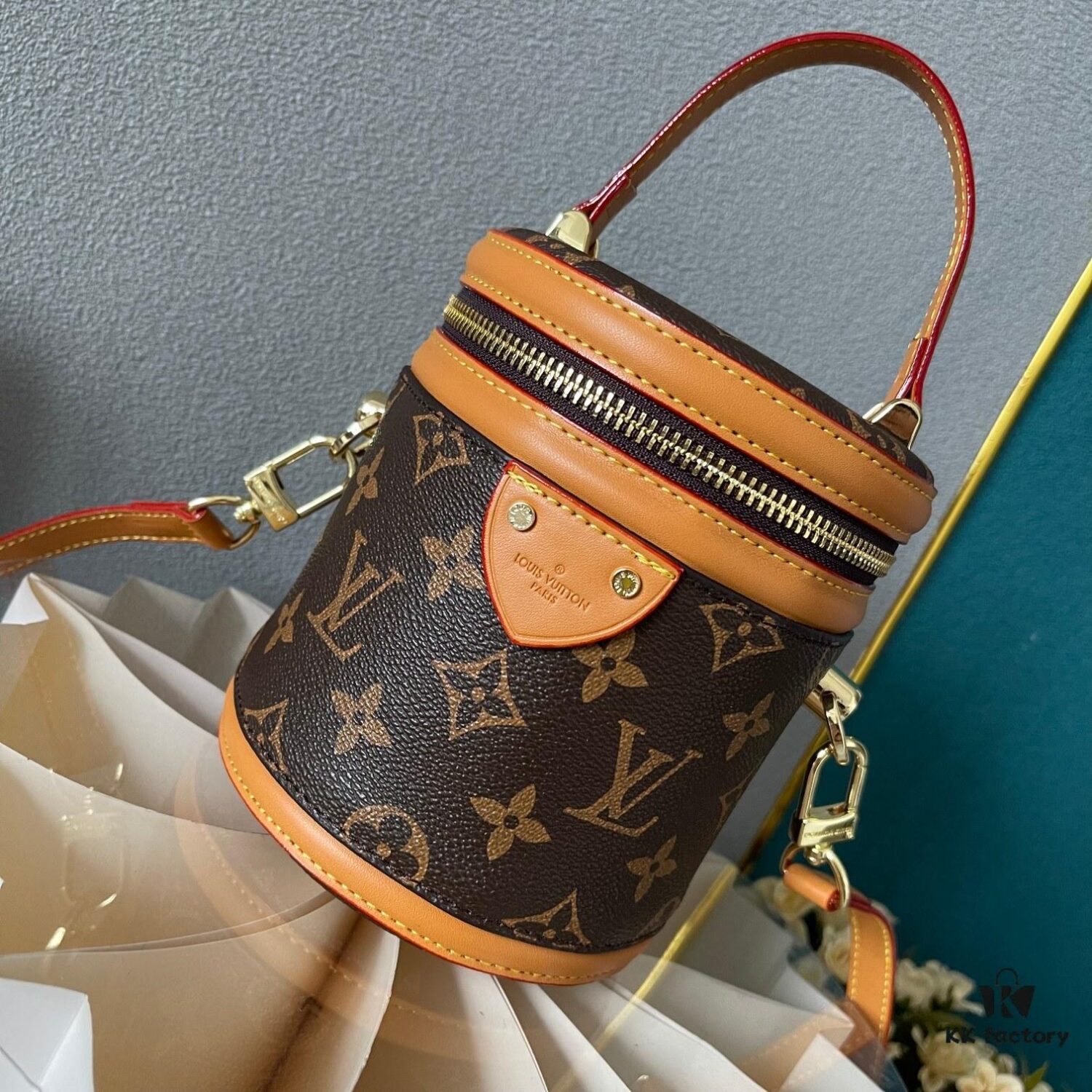 Upgraded Version [Exclusive Real Photo M82952 Damier Azur and Sunflower] This Nano Cannes Handbag features a cylindrical silhouette crafted from Monogram canvas, echoing the design of a makeup pouch.