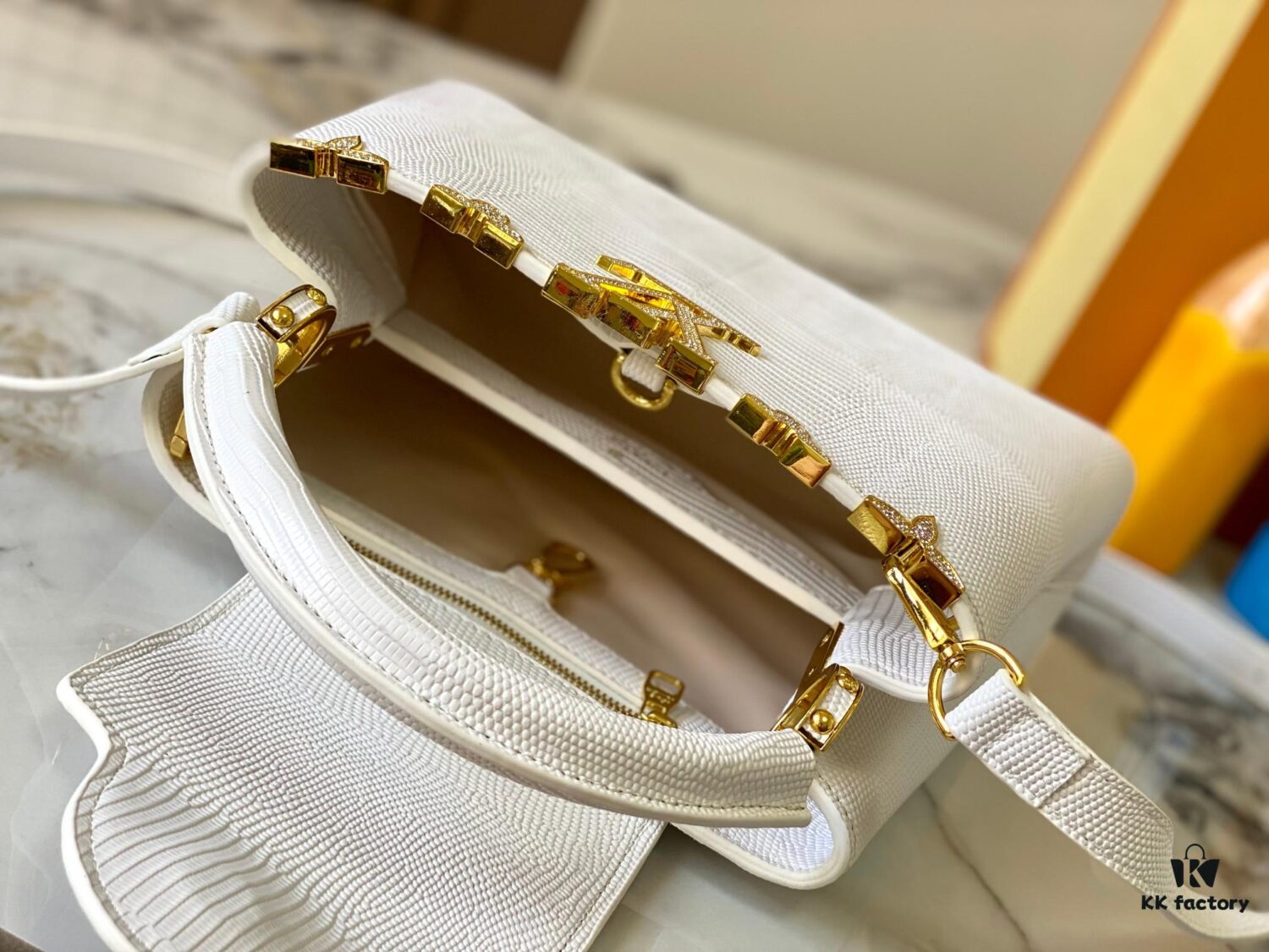 Top Quality Guangzhou Original M12297 White Lizard Skin with Gold Diamond Crown Triangle Capucines BB Bag