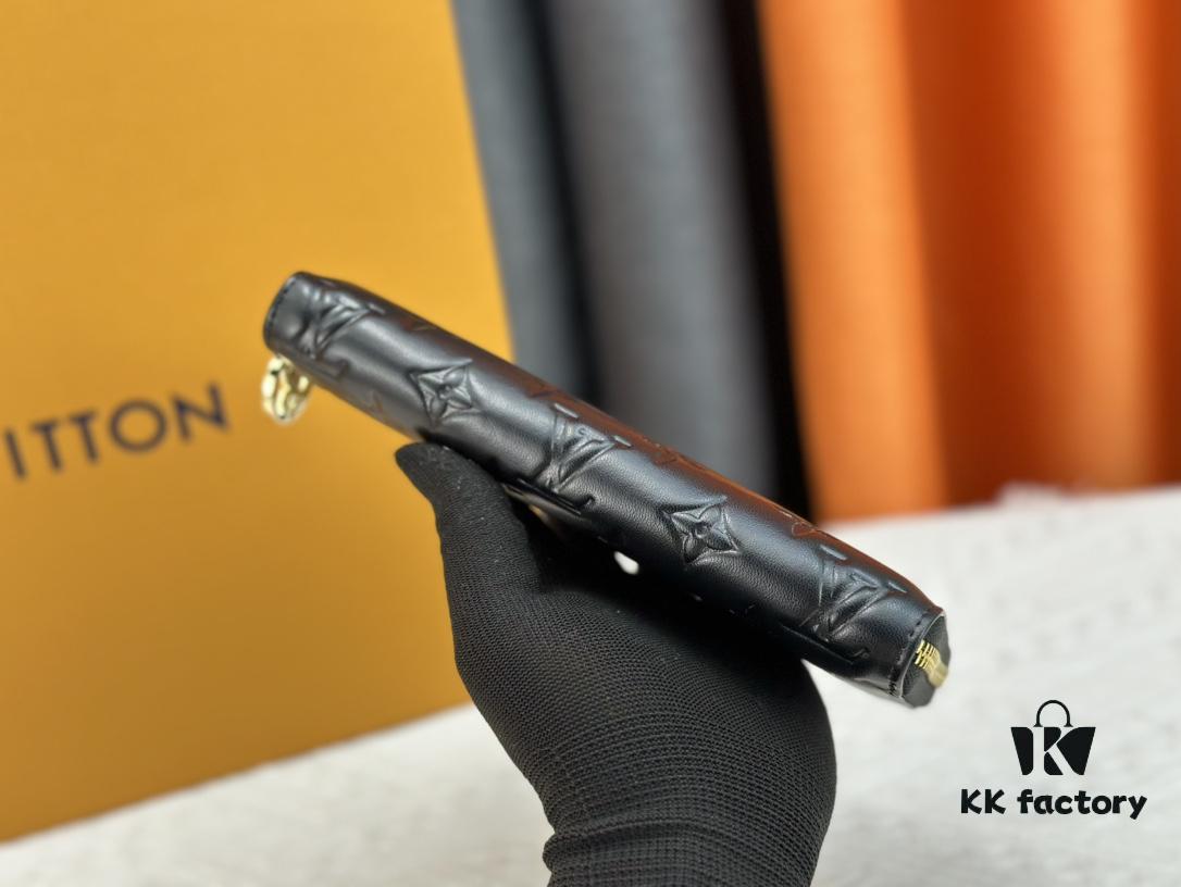 Wallet M81510 crafted in lambskin with padded Monogram embossed pattern, complementing the Coussin leather goods collection. The elegant design features a gold-tone zipper with an LV Circle pull tab. This multi-functional wallet includes practical interior features: three large compartments, a coin pocket, and twelve card slots.