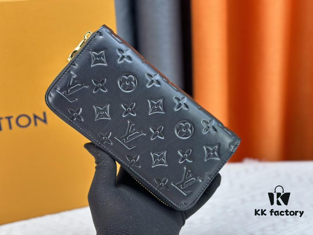 Wallet M81510 crafted in lambskin with padded Monogram embossed pattern, complementing the Coussin leather goods collection. The elegant design features a gold-tone zipper with an LV Circle pull tab. This multi-functional wallet includes practical interior features: three large compartments, a coin pocket, and twelve card slots.