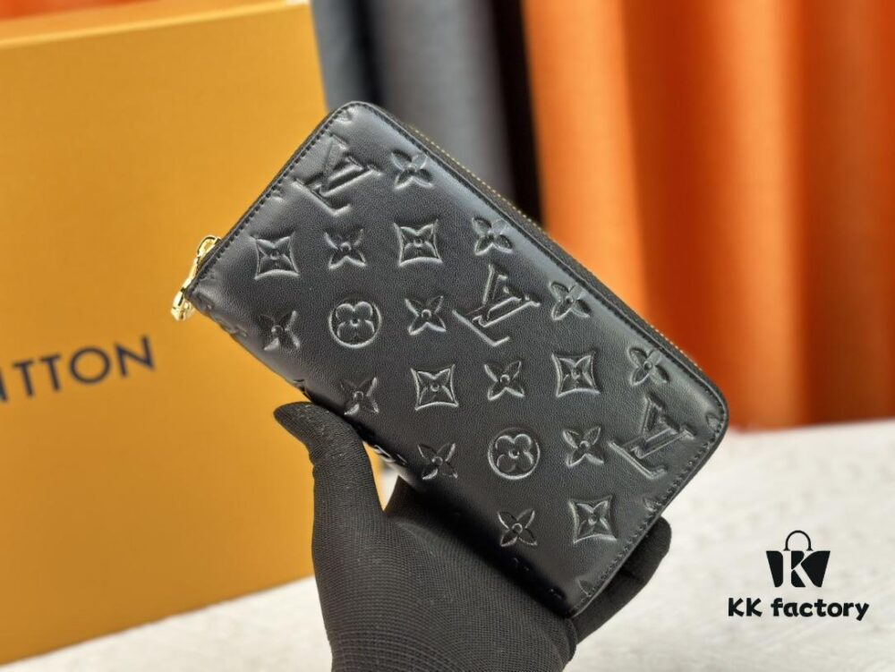 Wallet M81510 crafted in lambskin with padded Monogram embossed pattern, complementing the Coussin leather goods collection. The elegant design features a gold-tone zipper with an LV Circle pull tab. This multi-functional wallet includes practical interior features: three large compartments, a coin pocket, and twelve card slots.