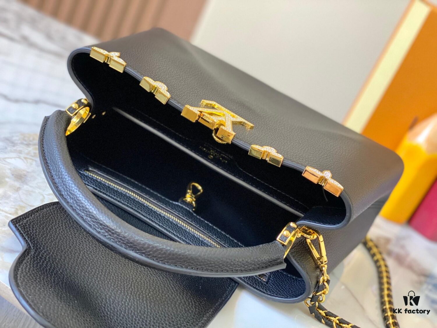69307eee6e68136f4d9a74bc Top Quality Original Guangzhou Version M24585 Black and Gold Diamond Flower Crown Capucines Handbag