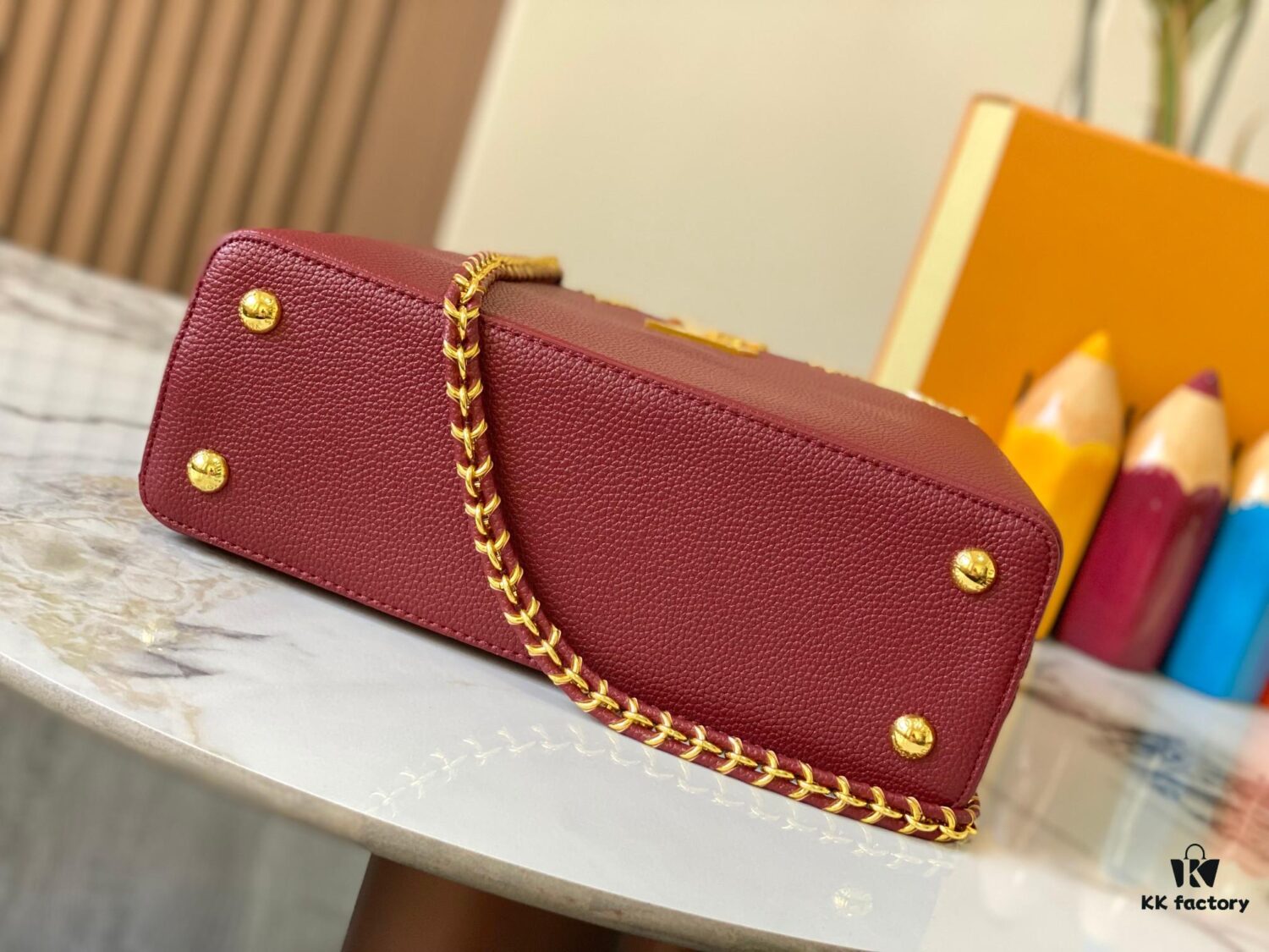 69307f0e6e68136f4d9a74e8 Top Quality Original Guangzhou Version M24585 Chestnut Red and Gold Diamond Flower Crown Capucines Handbag