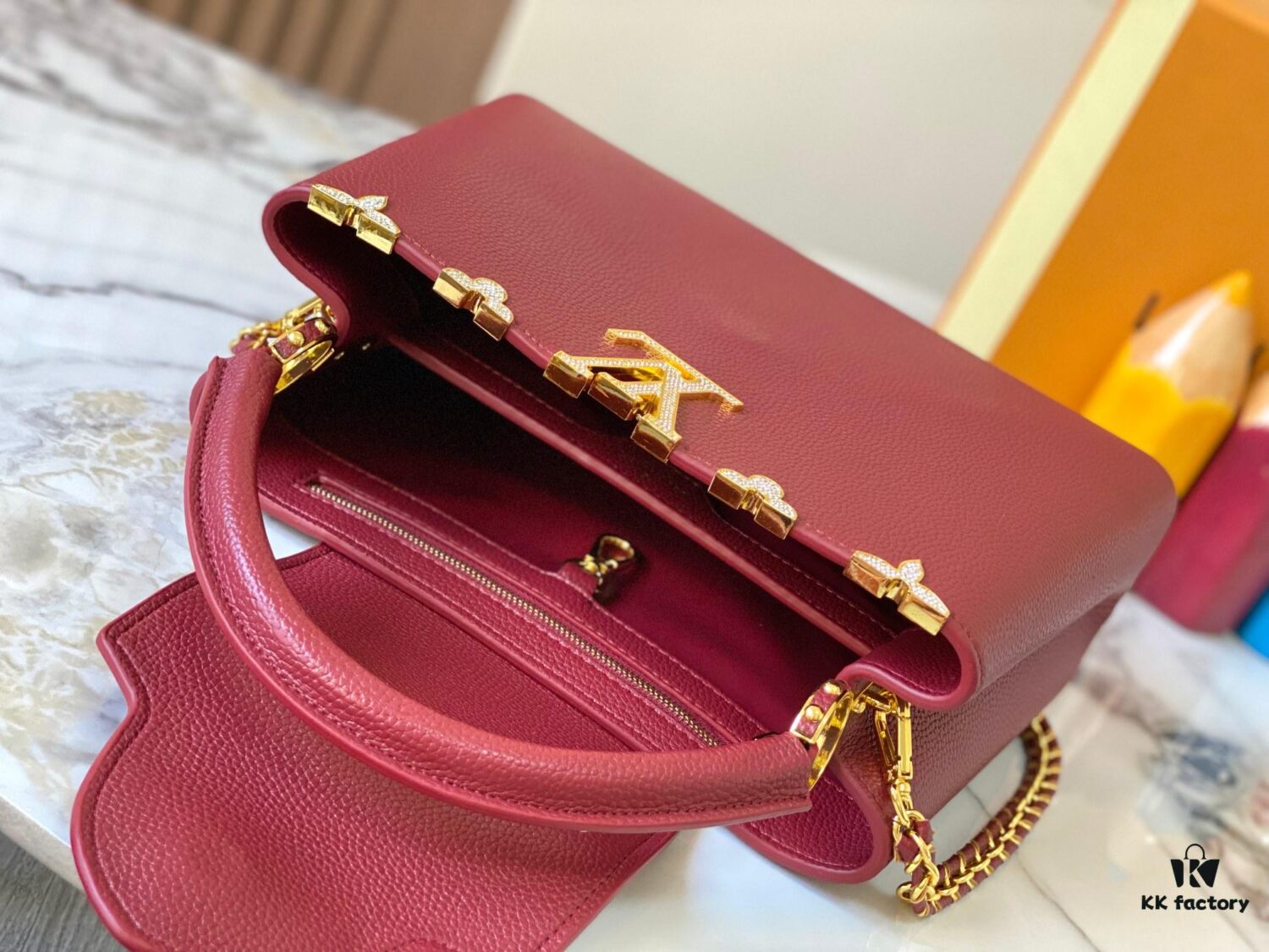 69307f0e6e68136f4d9a74ea Top Quality Original Guangzhou Version M24585 Chestnut Red and Gold Diamond Flower Crown Capucines Handbag