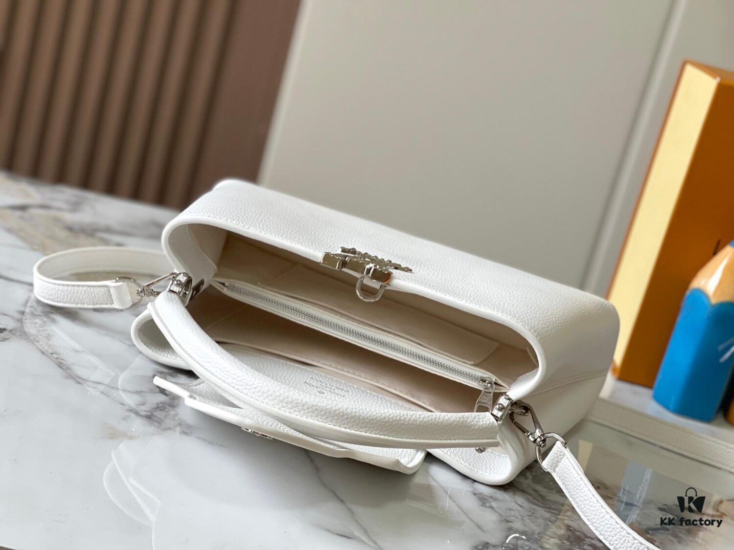 Upgraded M24664 Capucines East West Medium Handbag from the LV Crush Collection