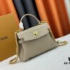 Exclusive Background Upgraded Original Version M21088 M21052 M20997 This Season, the Petite Lockme Ever Mini Bag Features Fashionable New Hues in Grained Calfskin Leather