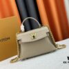 Exclusive Background Upgraded Original Version M21088 M21052 M20997 This Season, the Petite Lockme Ever Mini Bag Features Fashionable New Hues in Grained Calfskin Leather