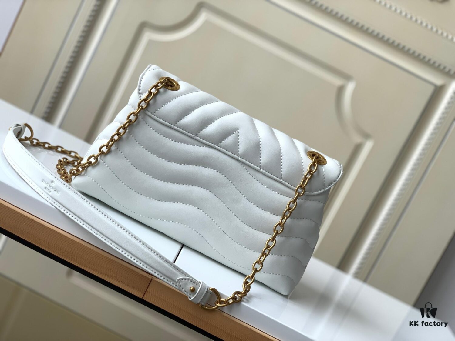 LV NEW WAVE Chain Bag with V-Shape Quilting, Fold-Over Closure and Multiple Compartments