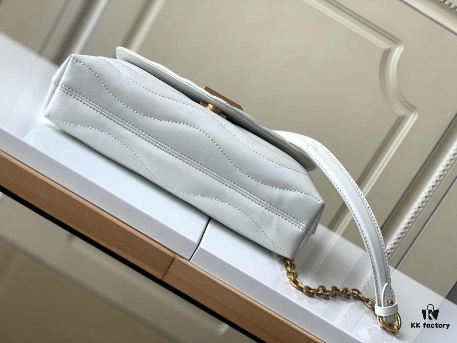 LV NEW WAVE Chain Bag with V-Shape Quilting, Fold-Over Closure and Multiple Compartments