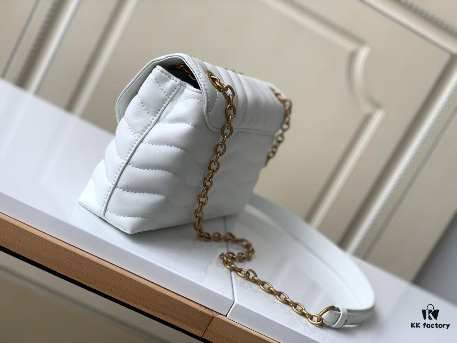 LV NEW WAVE Chain Bag with V-Shape Quilting, Fold-Over Closure and Multiple Compartments