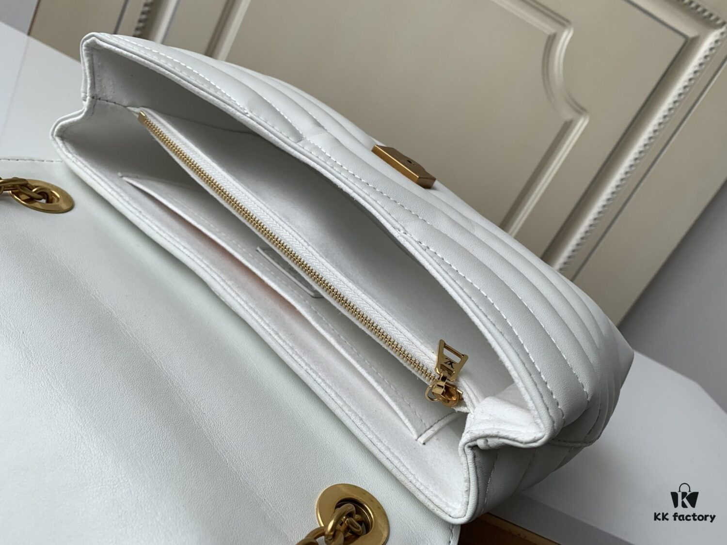 LV NEW WAVE Chain Bag with V-Shape Quilting, Fold-Over Closure and Multiple Compartments