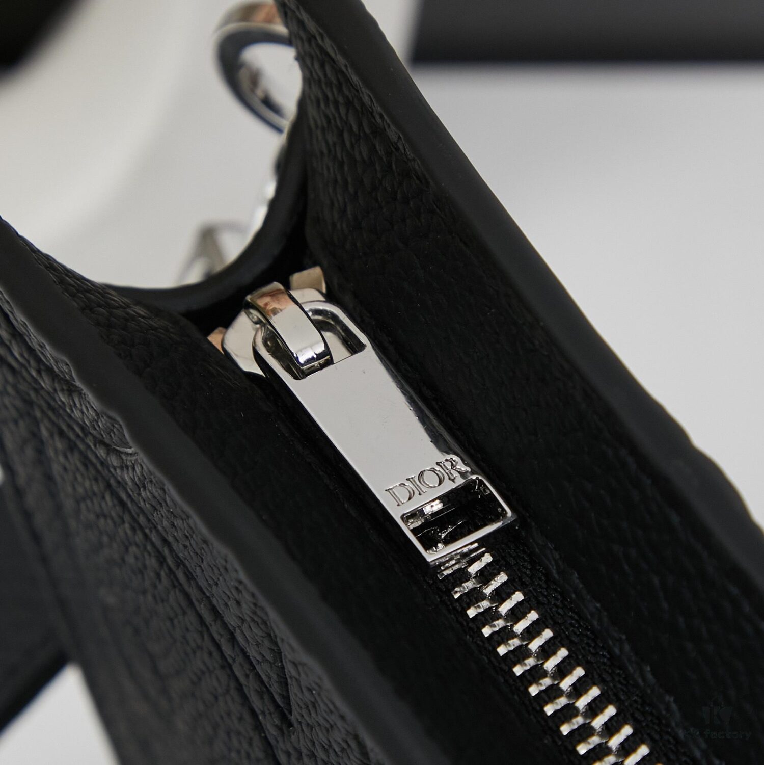 Dior Envelope Clutch with Box ||| Crafted from premium calf leather, this Dior envelope clutch draws inspiration from the brand's archives, featuring a signature Dior logo plaque on the front for elevated sophistication. Spacious zip compartment fits most smartphones, complemented by six card slots. Includes a detachable grained calfskin wrist strap with lobster clasp for versatile carrying options—either handheld or tucked into a larger handbag.