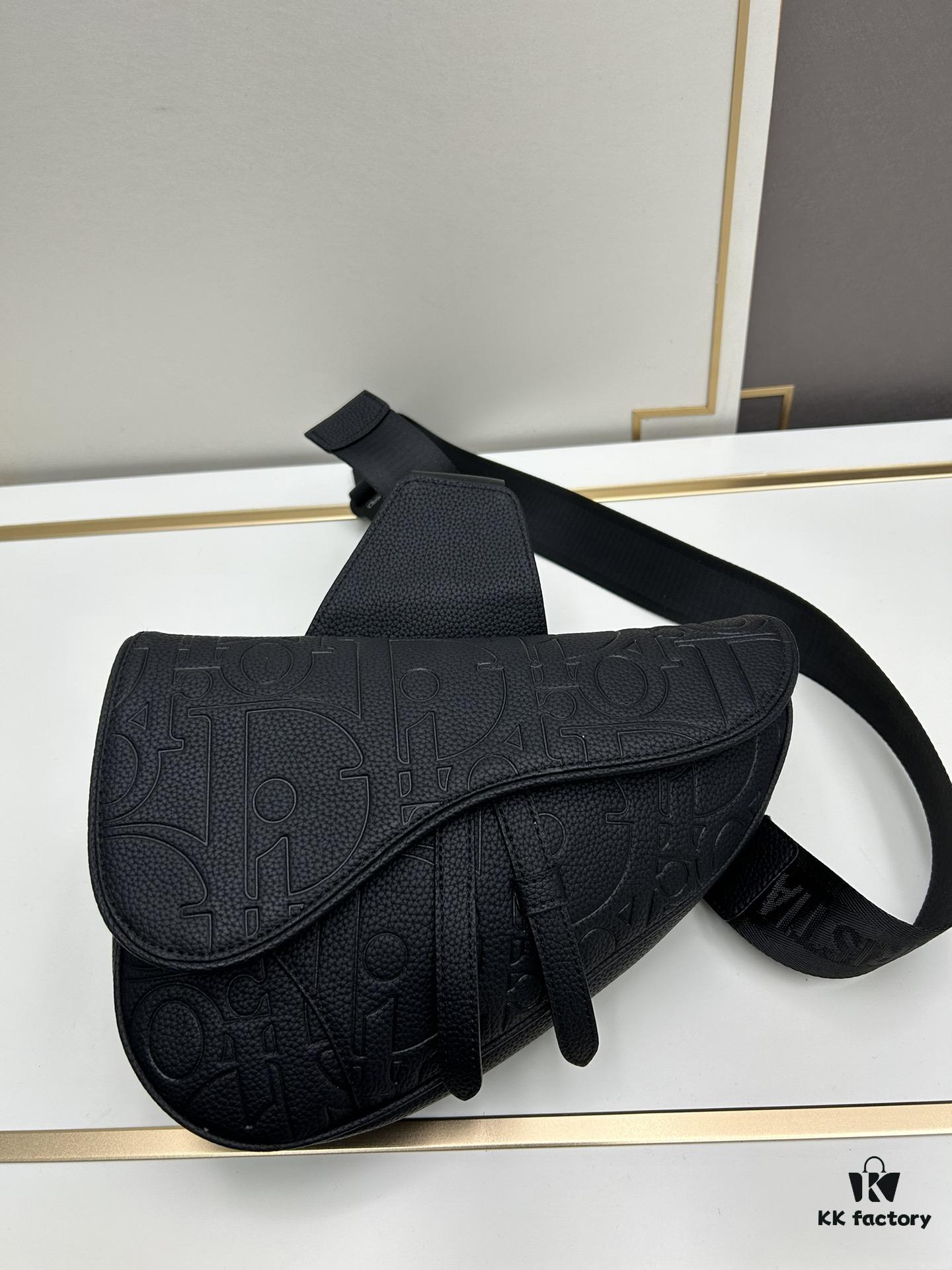 This boxed saddle bag is a new piece from the classic collection, meticulously crafted from black grained leather. A magnetic flap conceals a zip pocket for daily essentials, and it features an adjustable Christian Dior jacquard webbing strap for shoulder or crossbody wear.