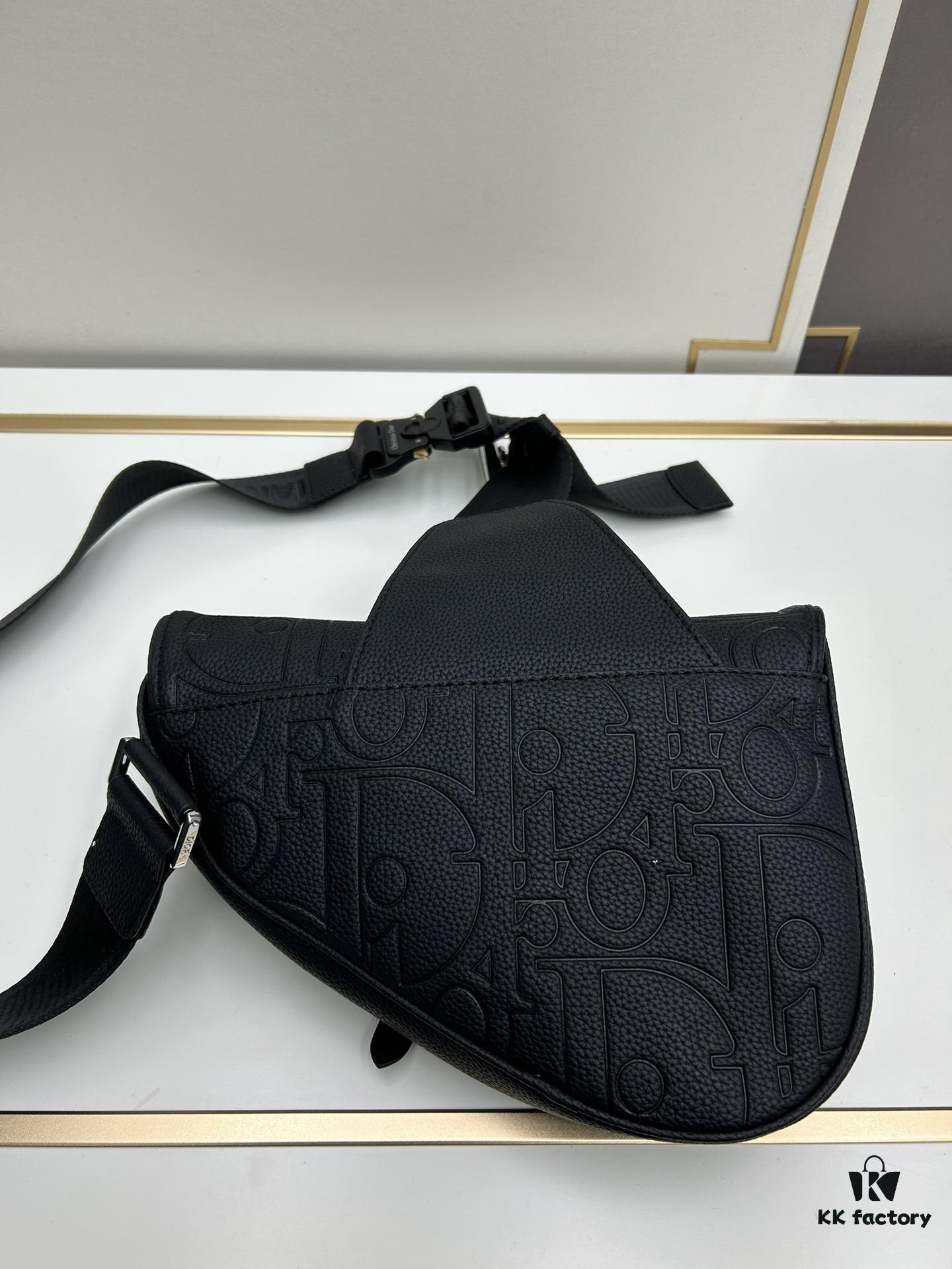 This boxed saddle bag is a new piece from the classic collection, meticulously crafted from black grained leather. A magnetic flap conceals a zip pocket for daily essentials, and it features an adjustable Christian Dior jacquard webbing strap for shoulder or crossbody wear.