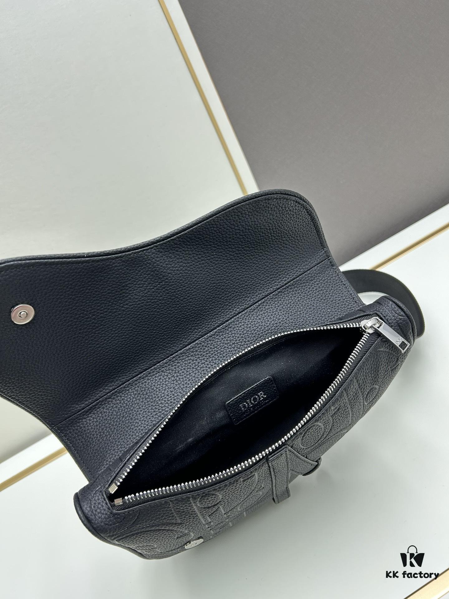 This boxed saddle bag is a new piece from the classic collection, meticulously crafted from black grained leather. A magnetic flap conceals a zip pocket for daily essentials, and it features an adjustable Christian Dior jacquard webbing strap for shoulder or crossbody wear.