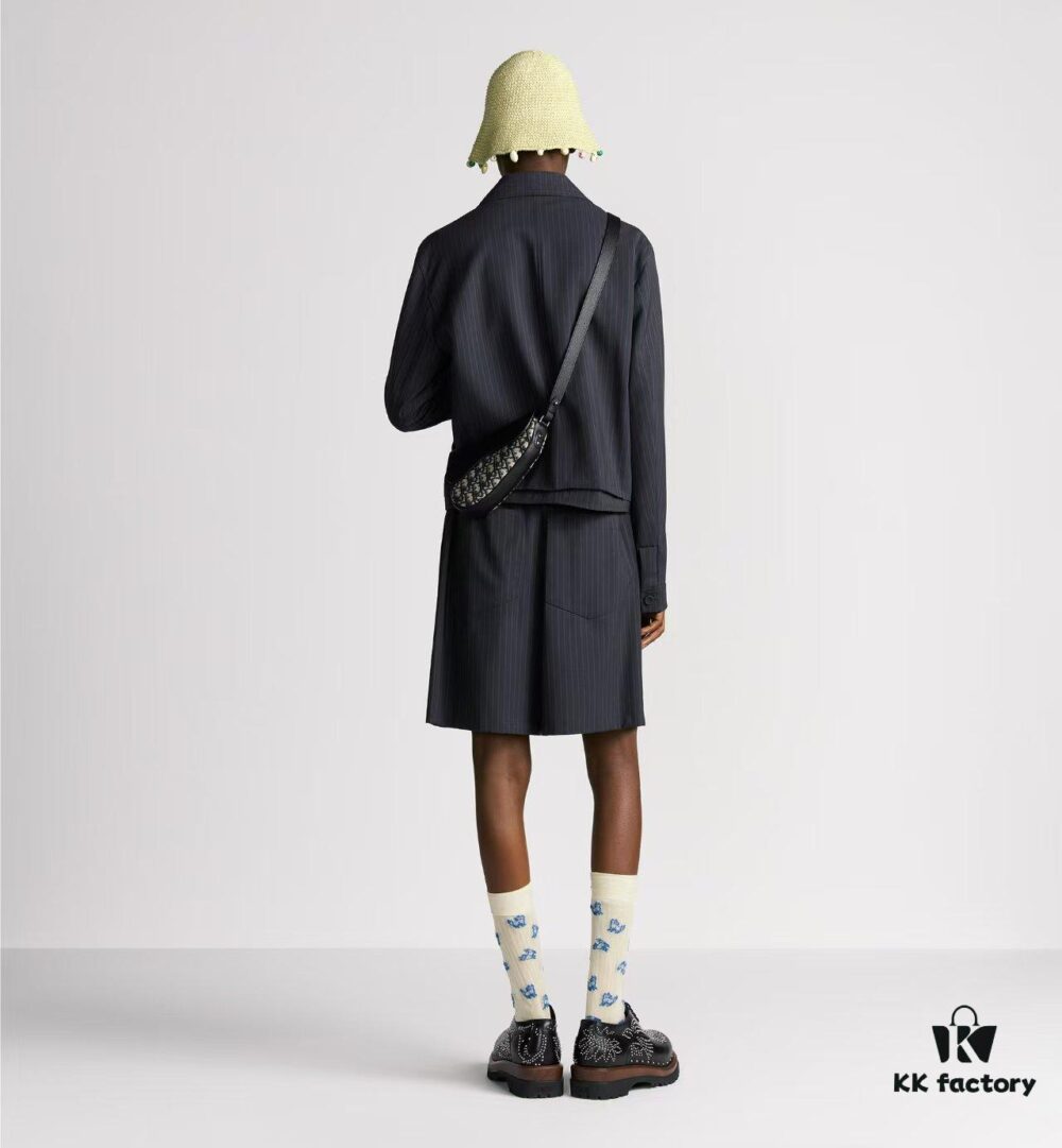 This saddle bag reinterprets the classic design with a modern structure. Crafted from beige and black Oblique printed fabric, it features a signature black grained cowhide magnetic flap and a concealed zip closure. The interior includes a large compartment and slip pockets for daily essentials. The mini style comes with an adjustable, detachable leather shoulder strap, allowing for handheld, shoulder, or crossbody wear.