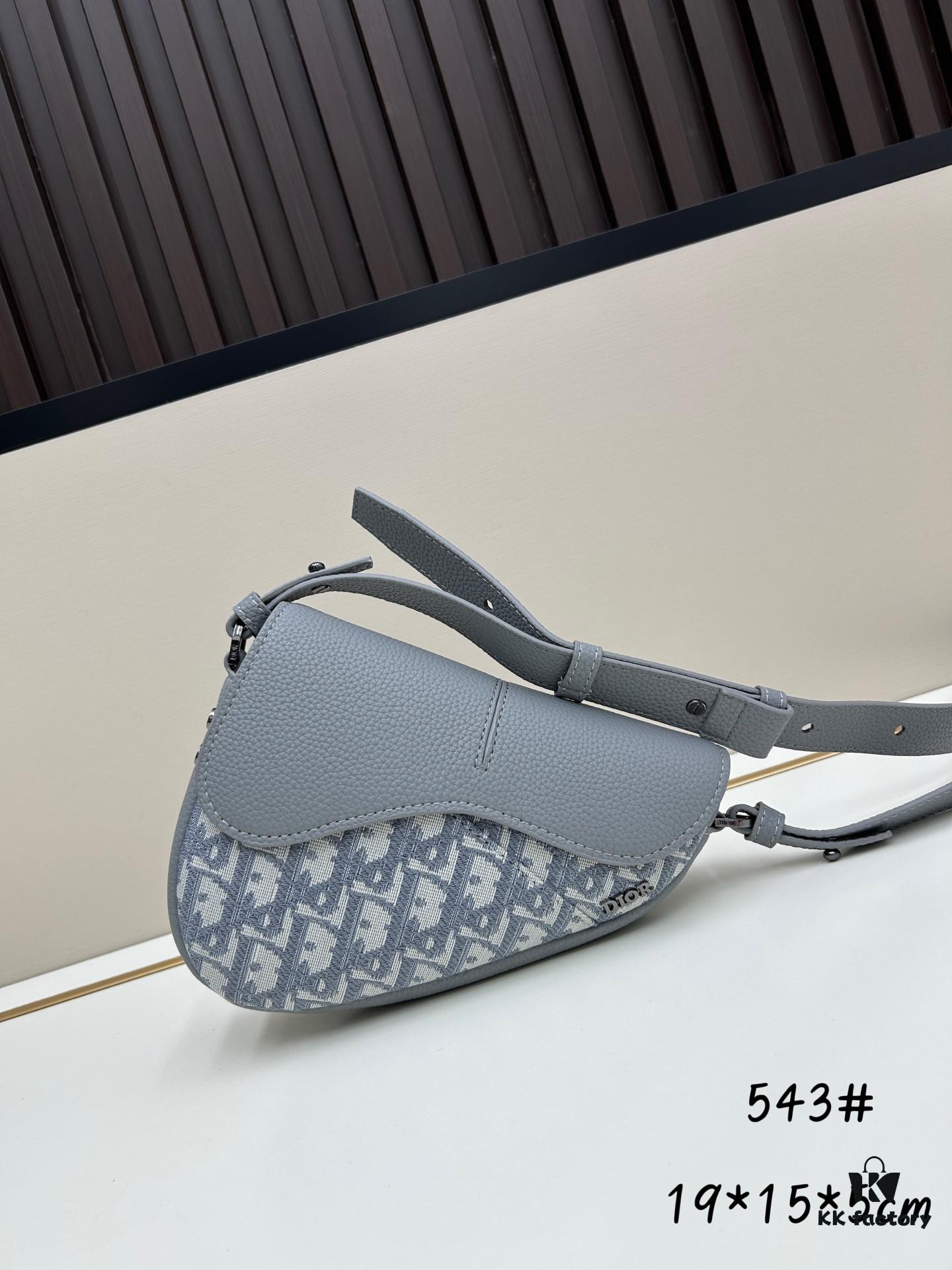 This saddle bag reinterprets the classic design with a modern structure. Crafted from beige and black Oblique print fabric, it features a signature black grained calfskin magnetic flap and a concealed zip closure. The interior includes a large compartment and slip pockets for organizing daily essentials. The mini style comes with an adjustable, detachable leather shoulder strap, allowing for handheld, shoulder, or crossbody wear.