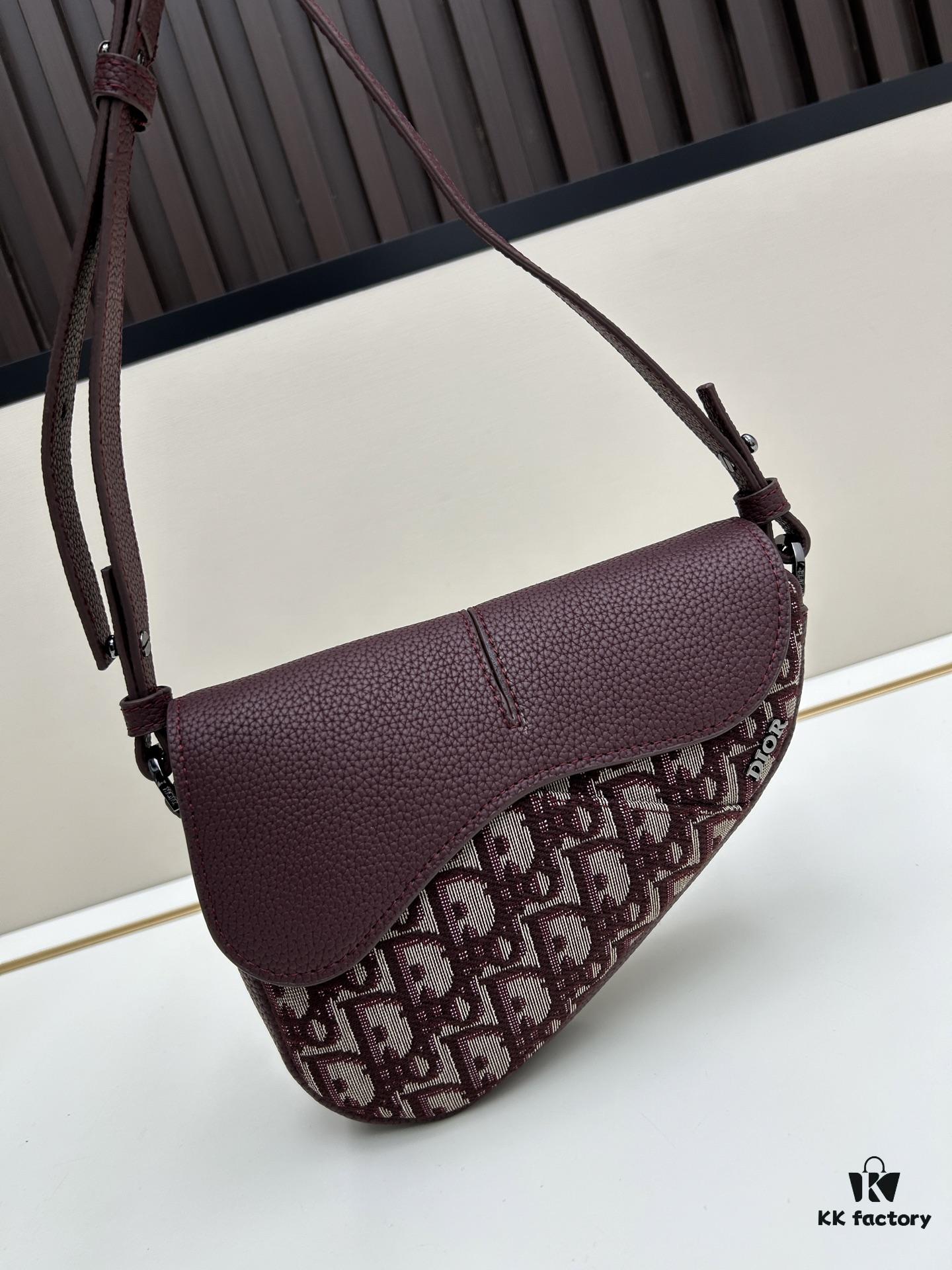 This saddle bag reinterprets the classic design with a modern structure. Crafted from beige and black Oblique printed fabric, it features a signature grained black calfskin magnetic flap and hidden zip closure. The interior includes a spacious compartment and slip pocket for daily essentials. The mini style comes with an adjustable, detachable leather shoulder strap, allowing for handheld, shoulder, or crossbody wear.