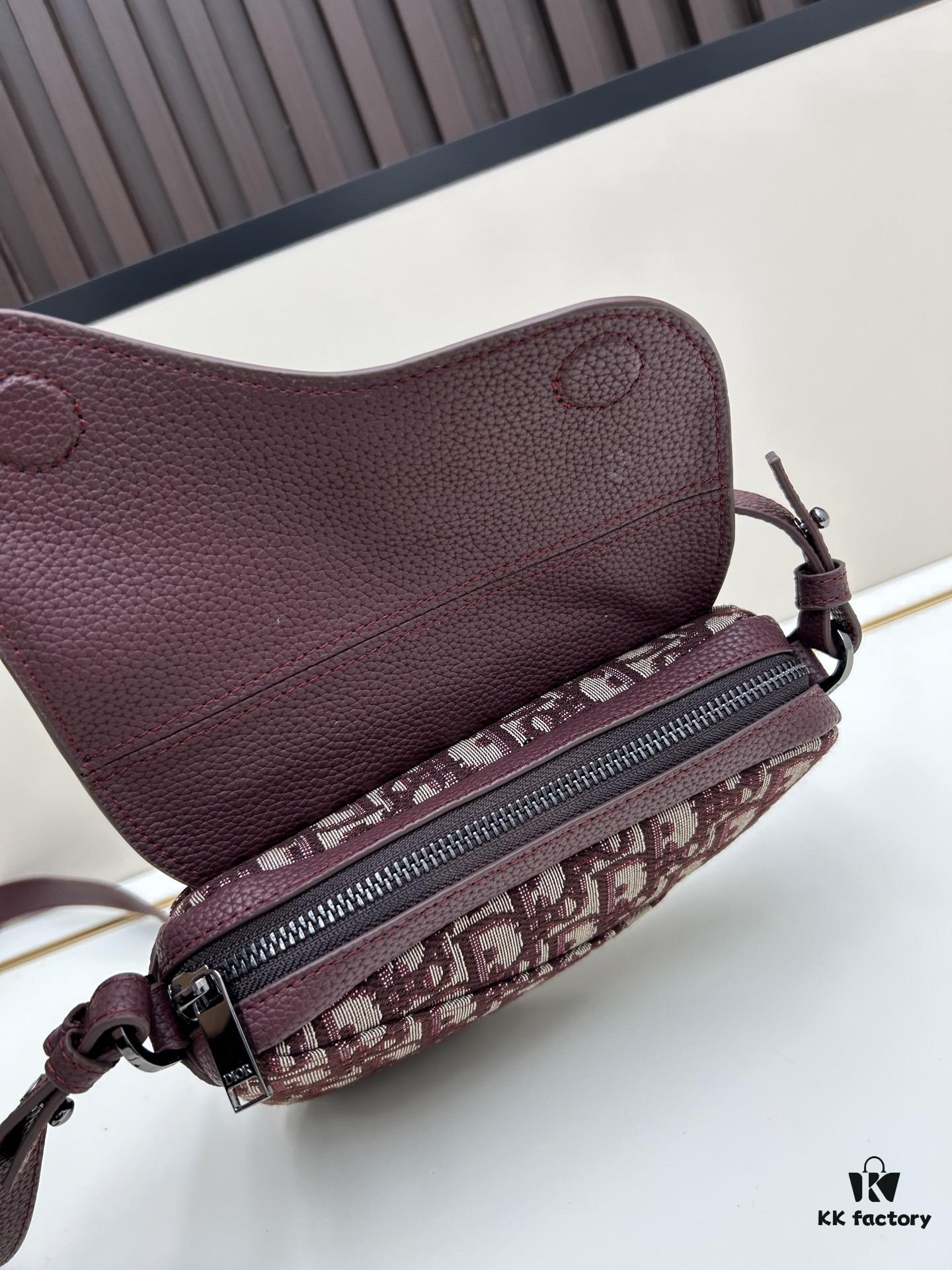 This saddle bag reinterprets the classic design with a modern structure. Crafted from beige and black Oblique printed fabric, it features a signature grained black calfskin magnetic flap and hidden zip closure. The interior includes a spacious compartment and slip pocket for daily essentials. The mini style comes with an adjustable, detachable leather shoulder strap, allowing for handheld, shoulder, or crossbody wear.