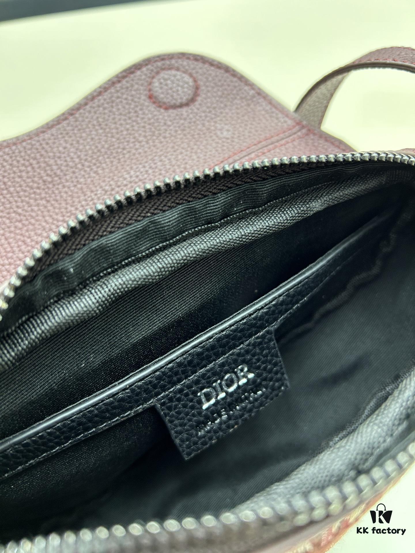 This saddle bag reinterprets the classic design with a modern structure. Crafted from beige and black Oblique printed fabric, it features a signature grained black calfskin magnetic flap and hidden zip closure. The interior includes a spacious compartment and slip pocket for daily essentials. The mini style comes with an adjustable, detachable leather shoulder strap, allowing for handheld, shoulder, or crossbody wear.