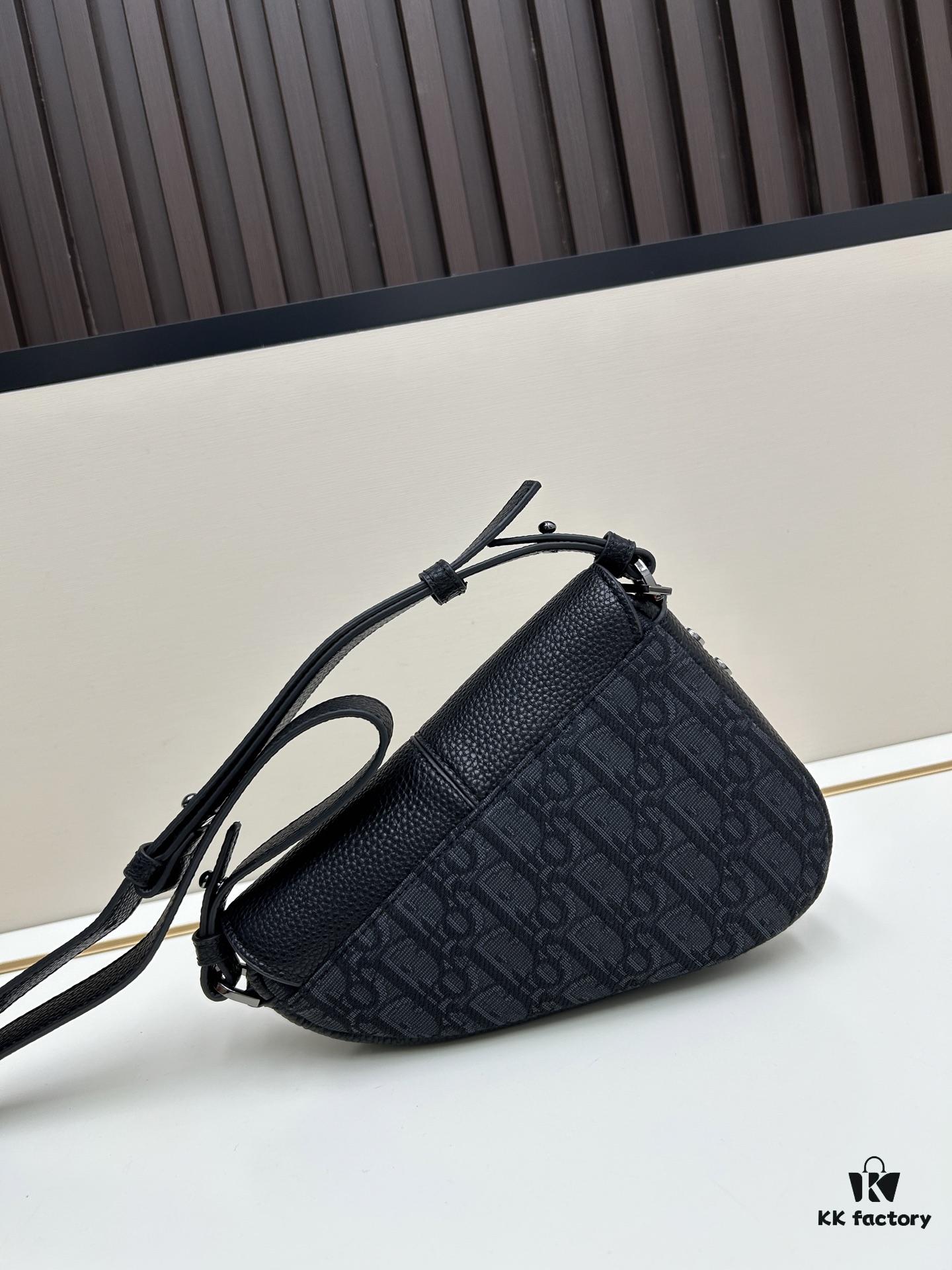 This saddle bag reinterprets the classic design with a modern structure. Crafted from beige and black Oblique printed fabric, it features a signature black grained calfskin magnetic flap and a concealed zip closure. The interior includes a large compartment and slip pockets for organizing daily essentials. This mini style comes with an adjustable and detachable leather shoulder strap, allowing for versatile wear as a handheld, shoulder, or crossbody bag.