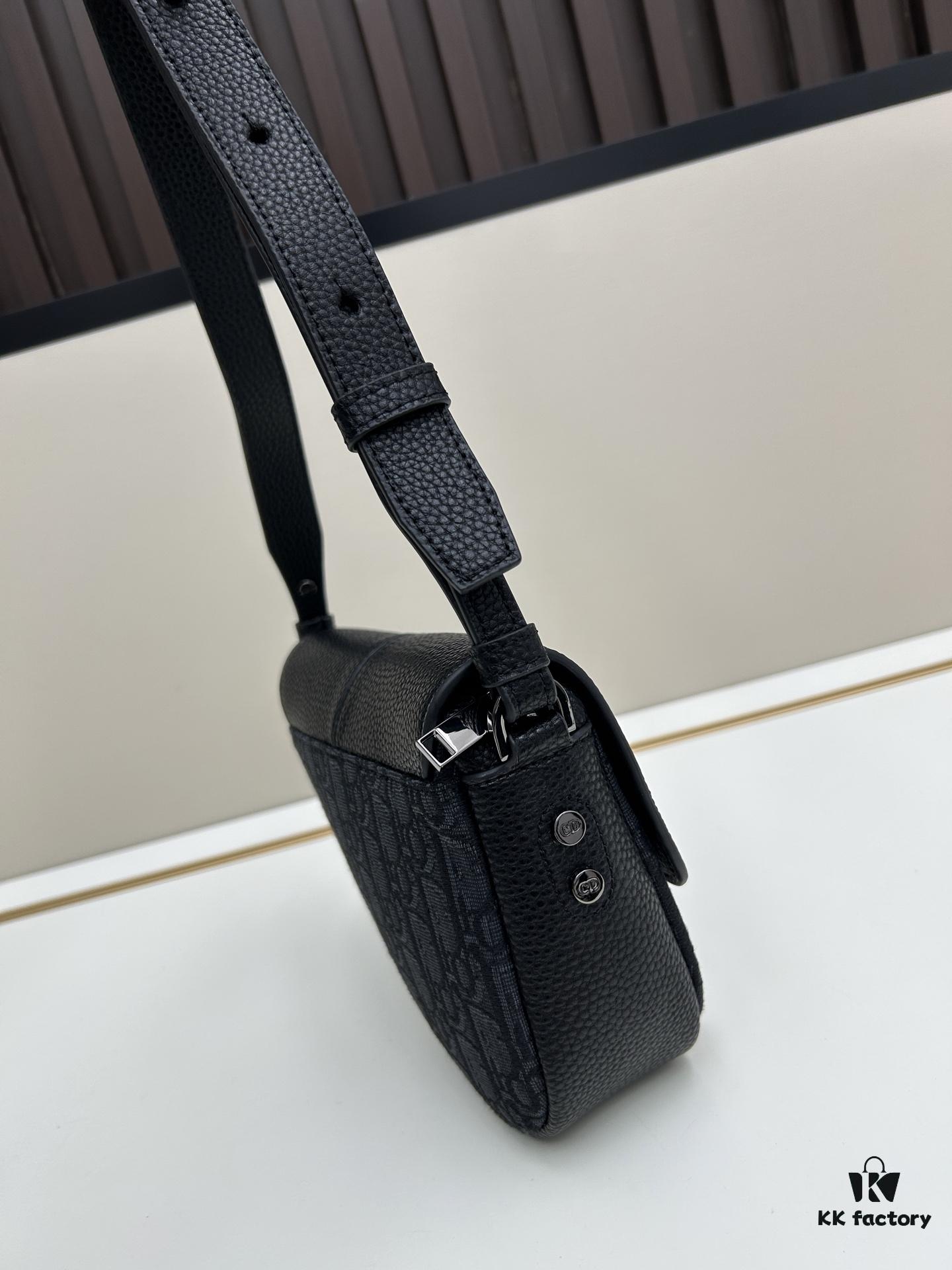 This saddle bag reinterprets the classic design with a modern structure. Crafted from beige and black Oblique printed fabric, it features a signature black grained calfskin magnetic flap and a concealed zip closure. The interior includes a large compartment and slip pockets for organizing daily essentials. This mini style comes with an adjustable and detachable leather shoulder strap, allowing for versatile wear as a handheld, shoulder, or crossbody bag.