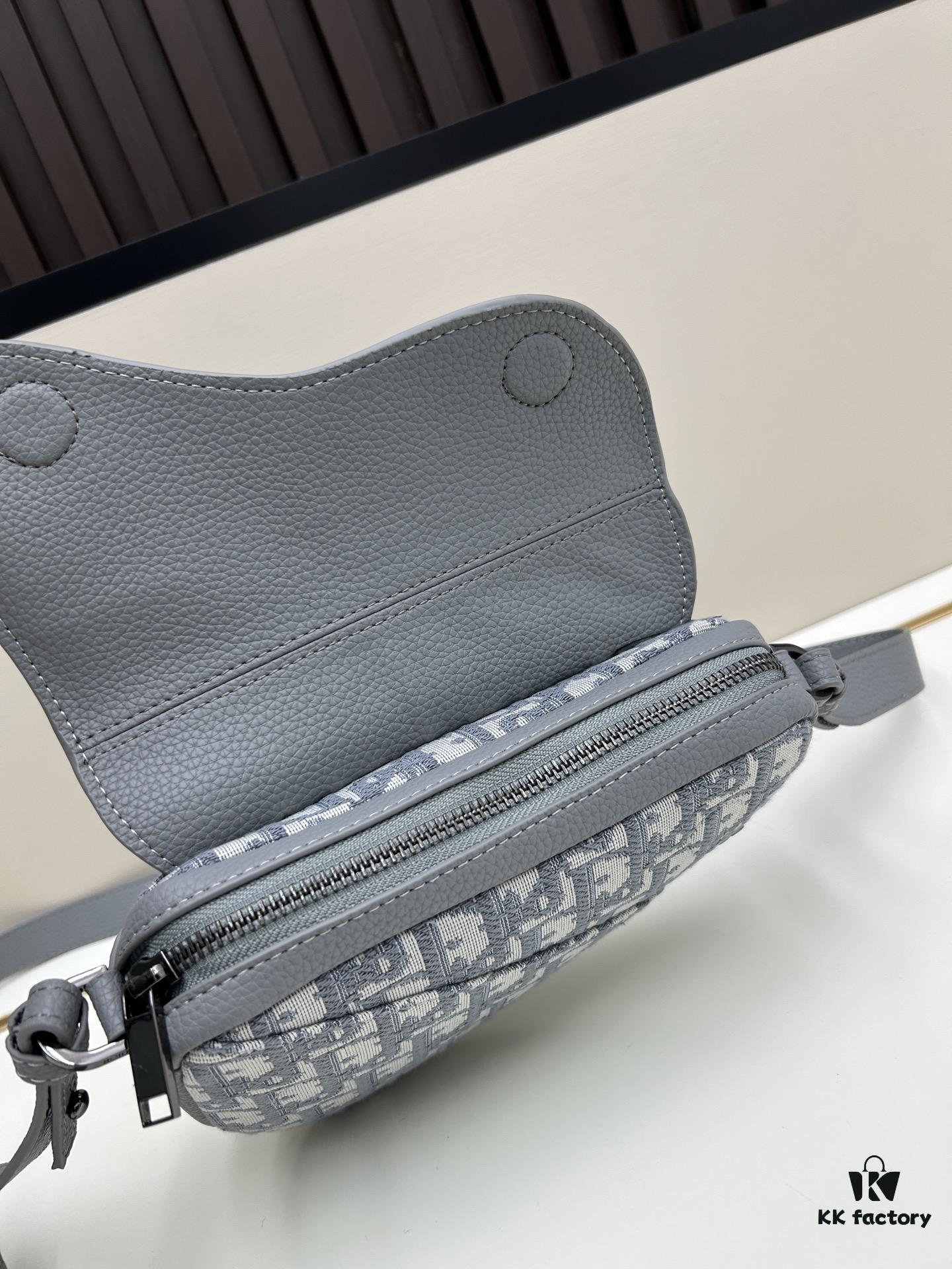 This saddle bag reinterprets the classic design with a modern structure. Crafted from beige and black Oblique print fabric, it features a signature black grained calfskin magnetic flap and a concealed zip closure. The interior includes a large compartment and slip pockets for organizing daily essentials. The mini style comes with an adjustable, detachable leather shoulder strap, allowing for handheld, shoulder, or crossbody wear.