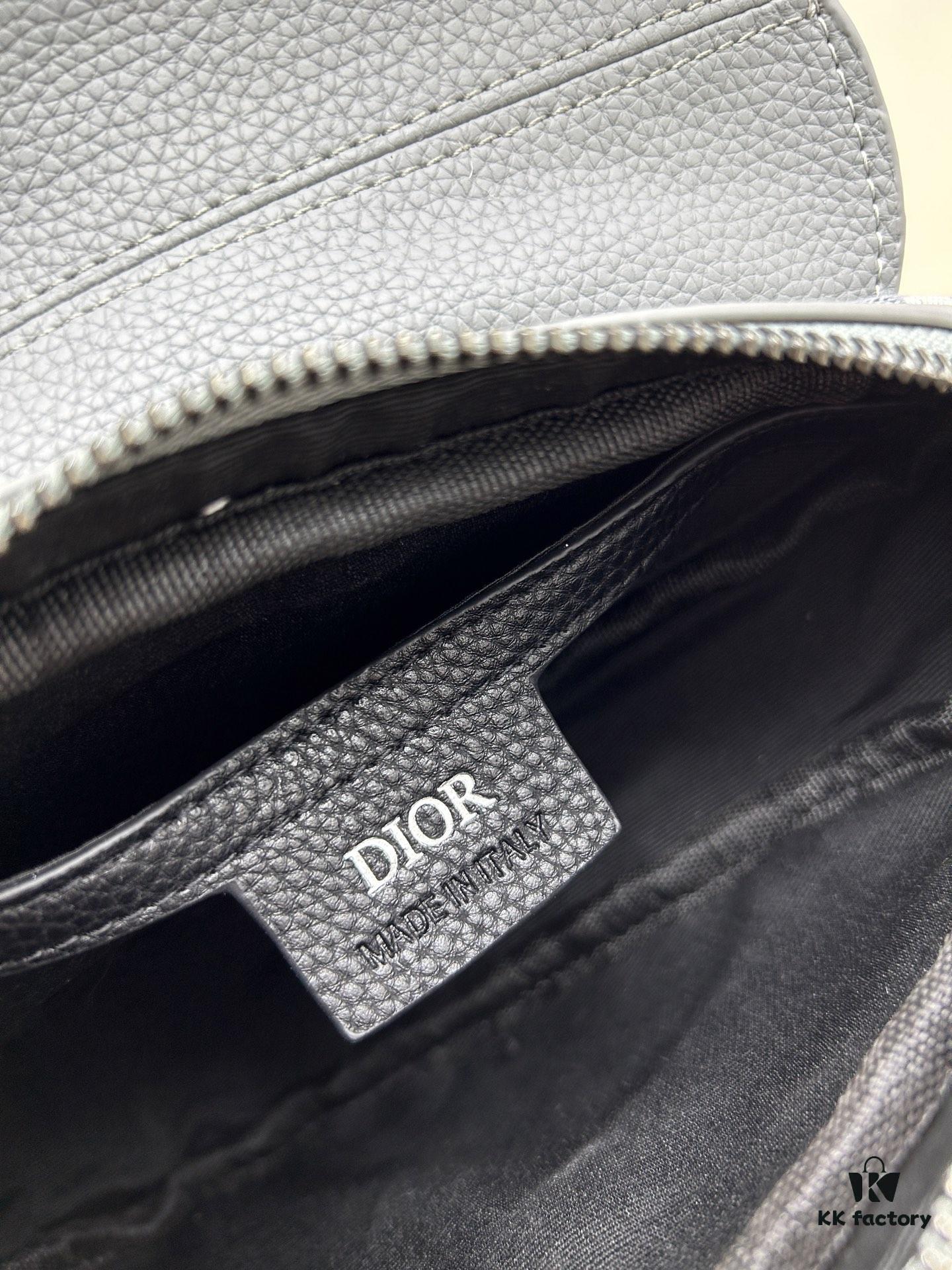 This saddle bag reinterprets the classic design with a modern structure. Crafted from beige and black Oblique print fabric, it features a signature black grained calfskin magnetic flap and a concealed zip closure. The interior includes a large compartment and slip pockets for organizing daily essentials. The mini style comes with an adjustable, detachable leather shoulder strap, allowing for handheld, shoulder, or crossbody wear.