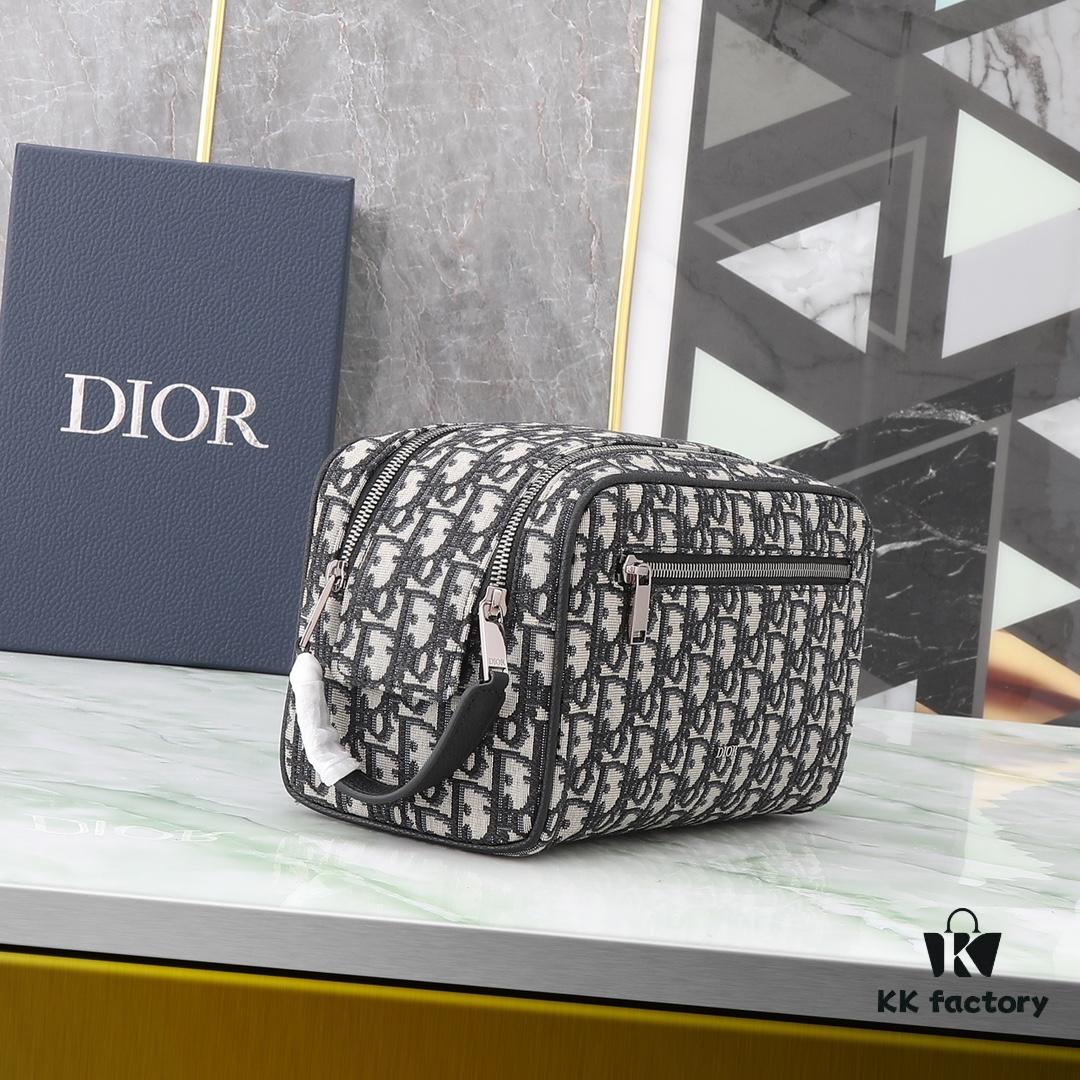 This toiletry bag combines practical functionality with minimalist design, crafted in beige and black Oblique printed fabric with black grained leather trims, featuring the Dior logo on the front.