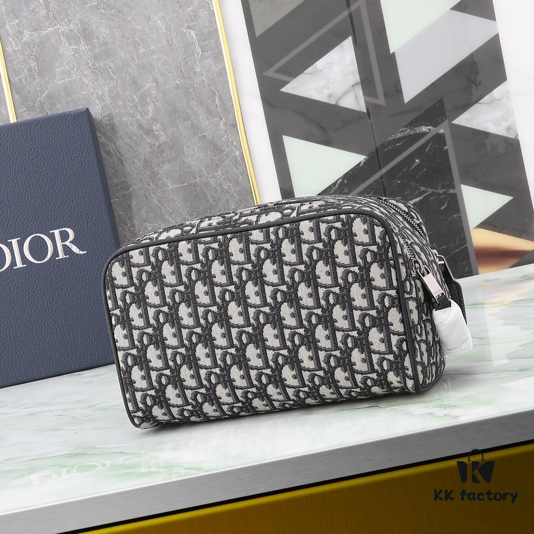 This toiletry bag combines practical functionality with minimalist design, crafted in beige and black Oblique printed fabric with black grained leather trims, featuring the Dior logo on the front.