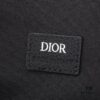 This toiletry bag combines practical functionality with minimalist design, crafted in beige and black Oblique printed fabric with black grained leather trims, featuring the Dior logo on the front.
