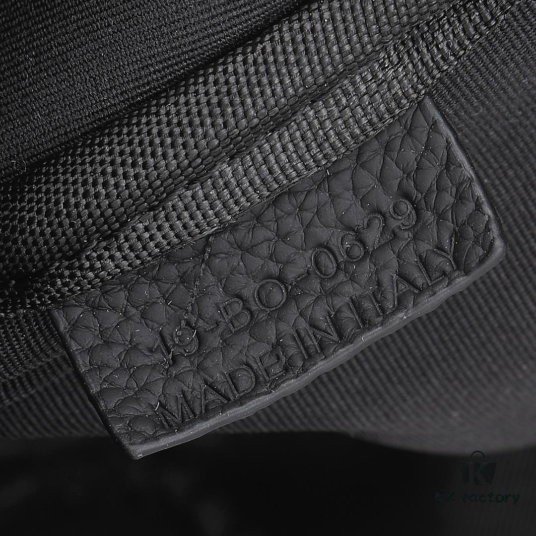 This toiletry bag combines practical functionality with minimalist design, crafted in beige and black Oblique printed fabric with black grained leather trims, featuring the Dior logo on the front.