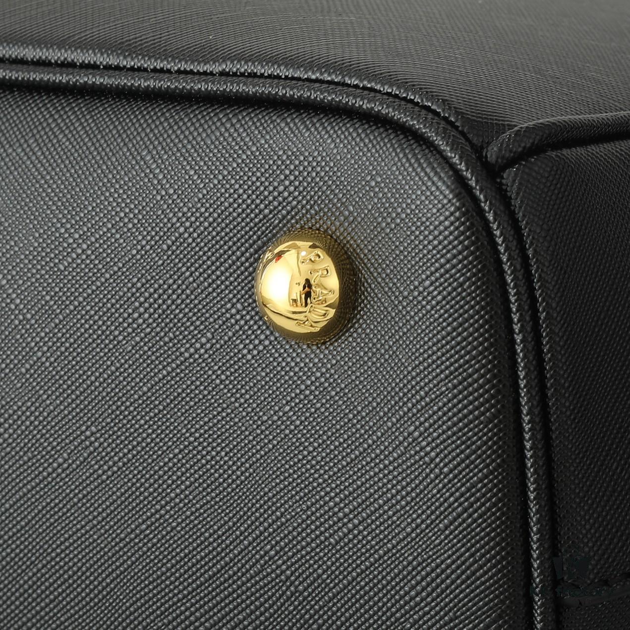 House Super Hot Killer Bag, Saffiano Leather, Dual Top Handles, Detachable Adjustable Leather Shoulder Strap, Gold-Tone Hardware, Triangle Logo with Metal Lettering on Leather, Snap Button Closure on Side, Two Outer Zip Pockets, Three Interior Pockets Including One with Zipper, Prada-Branded Lining