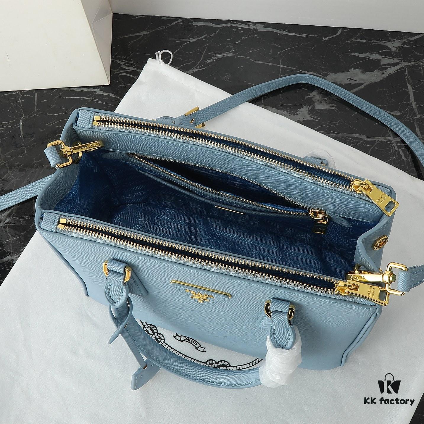 Model 1018 Home Super Hot Killer Bag, Saffiano Leather with Dual Top Handles, Detachable Adjustable Leather Shoulder Strap, Gold-Plated Hardware, Metal Logo Lettering on Triangular Leather Patch, Snap Button Closure on Side, Two Exterior Zip Pockets, Three Interior Pockets Including One Zip Pocket, Prada-Branded Lining