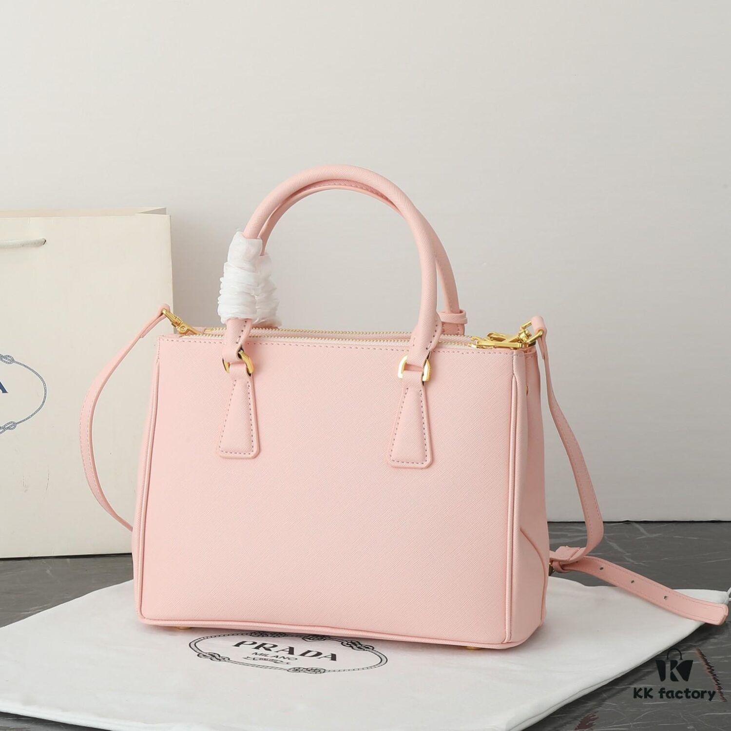 Model 1018 House Super Hot Killer Bag, Saffiano Leather with Dual Top Handles, Detachable Adjustable Leather Shoulder Strap, Gold-Tone Hardware, Metal Logo on Triangular Leather Patch, Snap Button Closure on Side, Two Zippered Outer Pockets, Three Interior Pockets Including One Zippered Compartment, Prada-Branded Lining