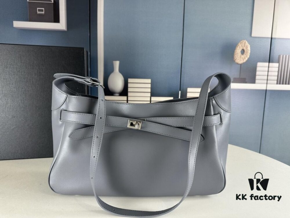 New Balenciaga Winter 24 Collection Re-See Shoulder Bucket Bag, Full-Grain Leather, Minimalist Luxury Design, Upcycled Motorbike Glove Clutch with Keychain Closure, Effortlessly Chic Look