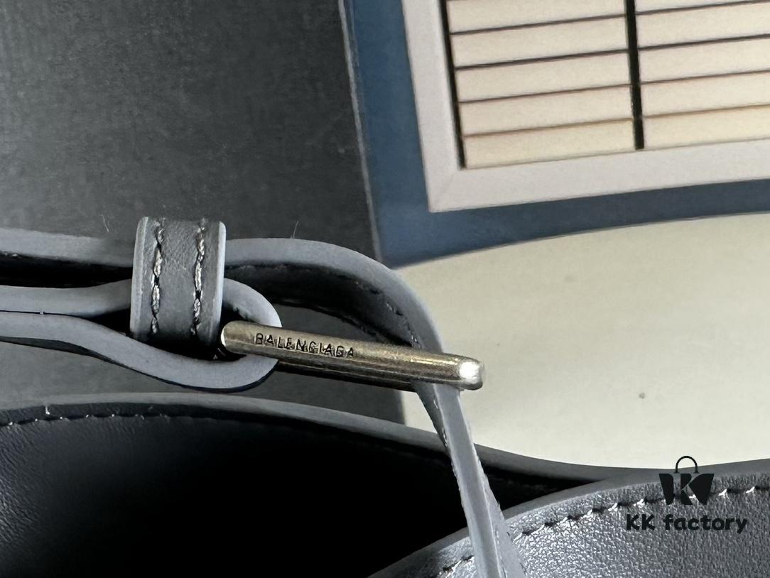 New Balenciaga Winter 24 Collection Re-See Shoulder Bucket Bag, Full-Grain Leather, Minimalist Luxury Design, Upcycled Motorbike Glove Clutch with Keychain Closure, Effortlessly Chic Look