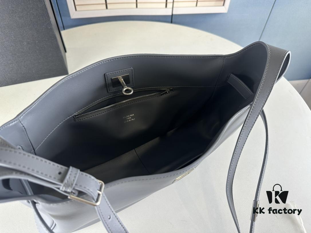 New Balenciaga Winter 24 Collection Re-See Shoulder Bucket Bag, Full-Grain Leather, Minimalist Luxury Design, Upcycled Motorbike Glove Clutch with Keychain Closure, Effortlessly Chic Look