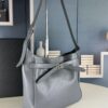 New Balenciaga Winter 24 Collection Re-see Shoulder Bucket Bag, Top Grain Leather, Minimalist Luxury Design, Upcycled Motorcycle Glove Handbag with Keychain Closure, Effortless Chic Style