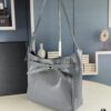 New Balenciaga Winter 24 Collection Re-see Shoulder Bucket Bag, Top Grain Leather, Minimalist Luxury Design, Upcycled Motorcycle Glove Handbag with Keychain Closure, Effortless Chic Style