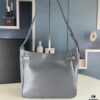 New Balenciaga Winter 24 Collection Re-see Shoulder Bucket Bag, Top Grain Leather, Minimalist Luxury Design, Upcycled Motorcycle Glove Handbag with Keychain Closure, Effortless Chic Style