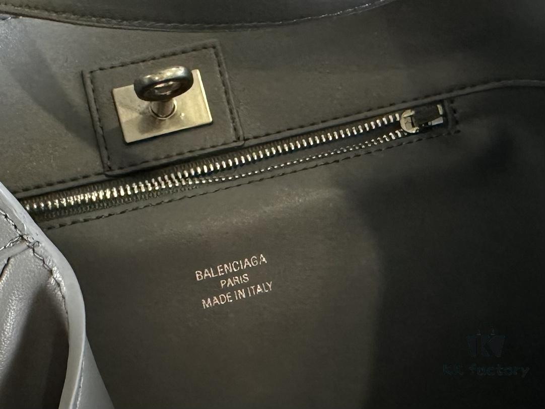 New Balenciaga Winter 24 Collection Re-see Shoulder Bucket Bag, Top Grain Leather, Minimalist Luxury Design, Upcycled Motorcycle Glove Handbag with Keychain Closure, Effortless Chic Style