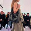 New Balenciaga Winter 24 Collection Re-See Shoulder Bucket Bag, Top-Grain Leather, Minimalist Luxury Design, Upcycled Motorbike Glove Handbag with Keychain Closure, Effortless Chic Style