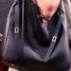 New Balenciaga Winter 24 Collection Re-See Shoulder Bucket Bag, Top-Grain Leather, Minimalist Luxury Design, Upcycled Motorbike Glove Handbag with Keychain Closure, Effortless Chic Style