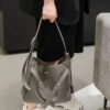 New Balenciaga Winter 24 Collection Re-See Shoulder Bucket Bag, Top-Grain Leather, Minimalist Luxury Design, Upcycled Motorbike Glove Handbag with Keychain Closure, Effortless Chic Style