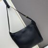 New Balenciaga Winter 24 Collection Re-see Handbag, Shoulder Bucket Bag in Full-Grain Leather, Minimalist Luxury Design Upcycled from Motorcycle Gloves with Keychain Closure, Effortlessly Chic Oversized Look
