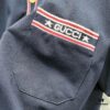 GUCCI Men's Polo Shirt with Lapel, Embroidered Logo, Color-Block Striped Pocket Design