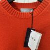 DIOR 25SS New Arrival Knitwear from the DIOR AND KAWS Limited Collection. Crafted from red and burgundy wool knit fabric, one sleeve features the DIOR AND KAWS signature embroidery, reinterpreting the Dior logo with a vibrant serpentine motif. The hem and cuffs feature contrasting details, perfect for pairing with classic jeans or shorts to create a striking look.