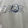 Dior 25ss New Arrival T-Shirt Featuring Signature Motif from the Dior and Hylton Nel Collaboration Collection This Season. Crafted from Premium White Cotton Jersey, This Classic Silhouette Boasts a Ribbed Round Neckline and Embroidered Detailing on the Chest for Elevated Style. Designed with a Relaxed Fit, Perfectly Paired with Sweatpants or Jeans.